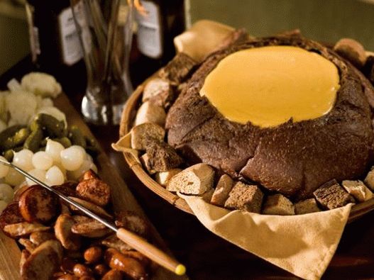 Foto de fondue con cerveza y cheddar en alemán