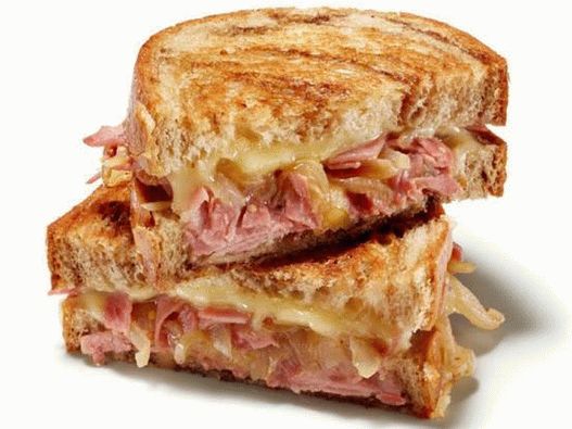 Foto de sándwich de queso caliente y carne en conserva
