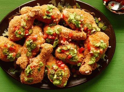 Foto de muslos de pollo empanizados con chips de maíz y queso