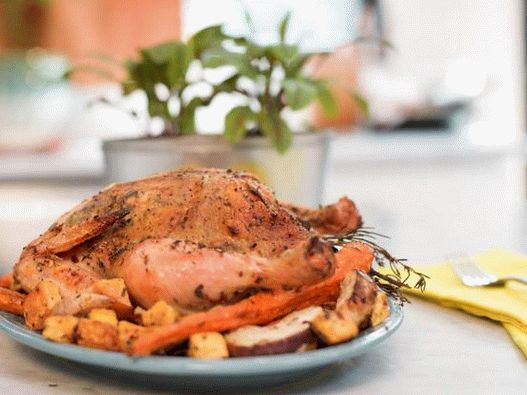 Pollo con hierbas aromáticas y tubérculos al horno