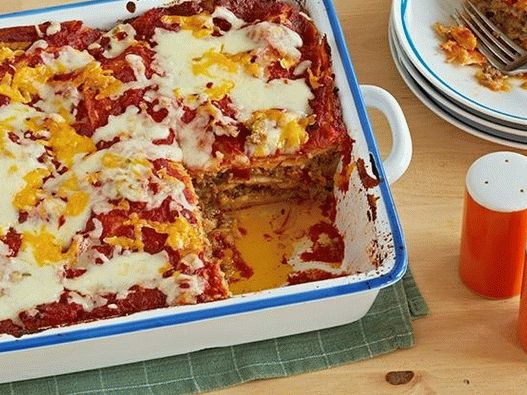 Foto Cazuela de ternera con salsa de queso y enchiladas